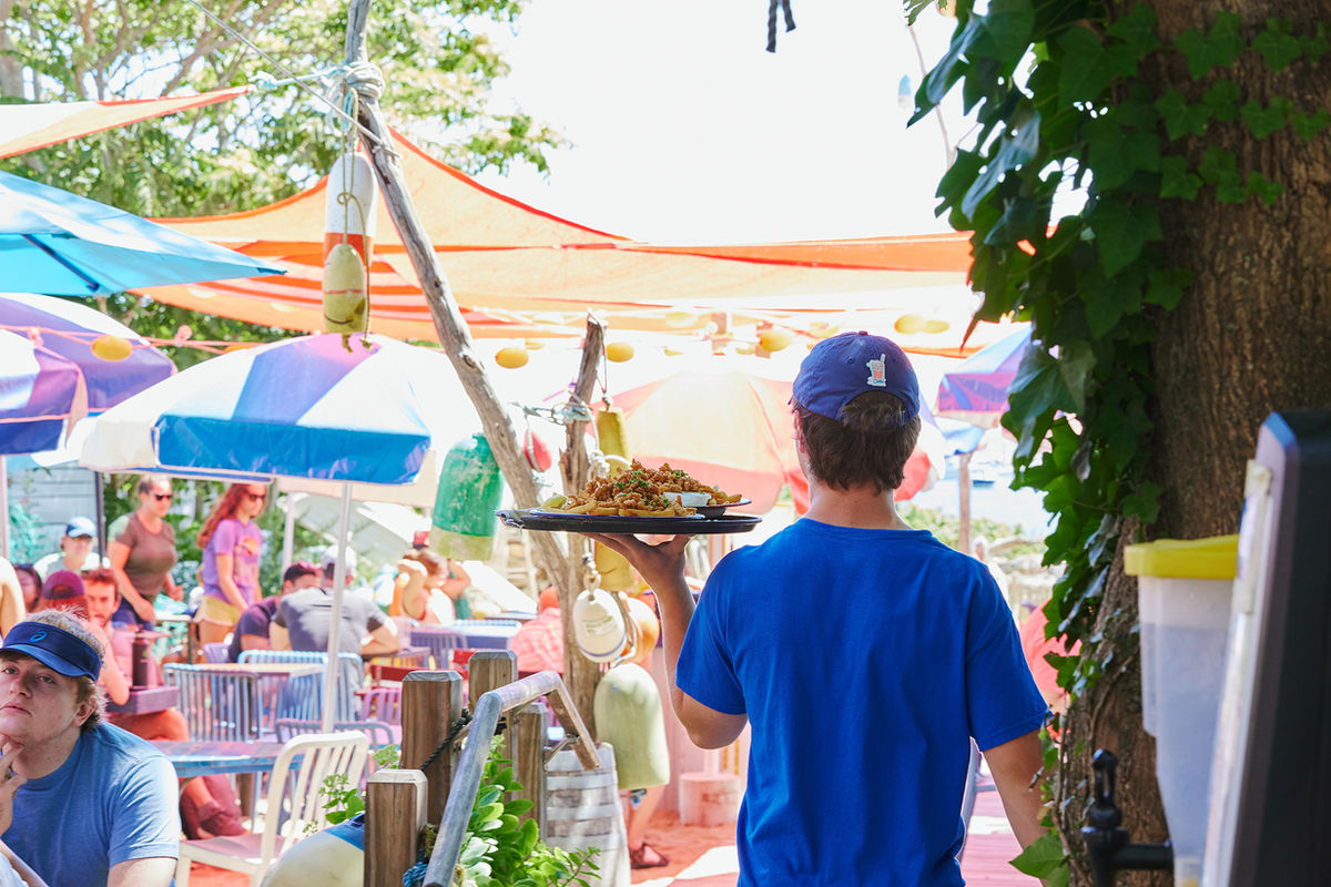 Outdoor dining beneath colorful shades at The Canteen in Provincetown