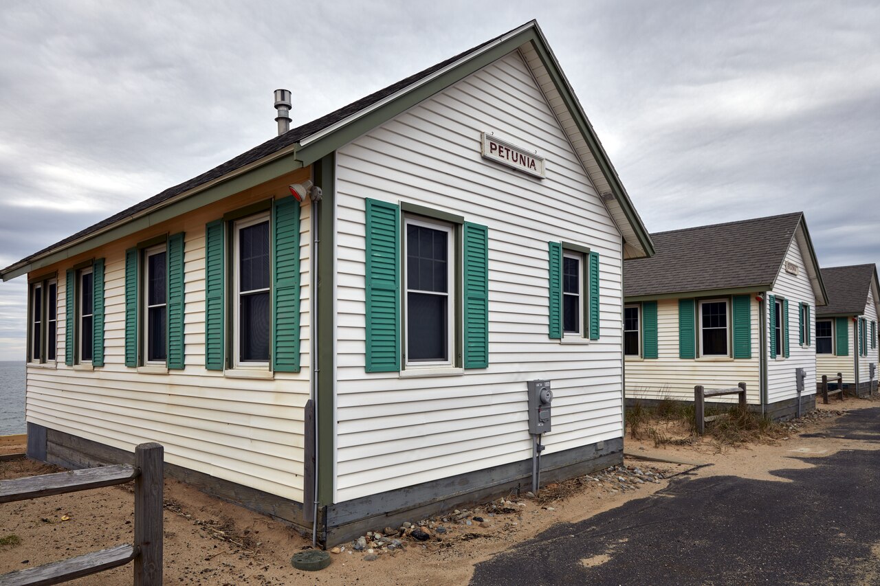 Petunia and neighboring Days’ Cottages in North Truro, photographed in May 2019