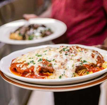 A plated Italian dinner with pasta pictured on Montano’s website