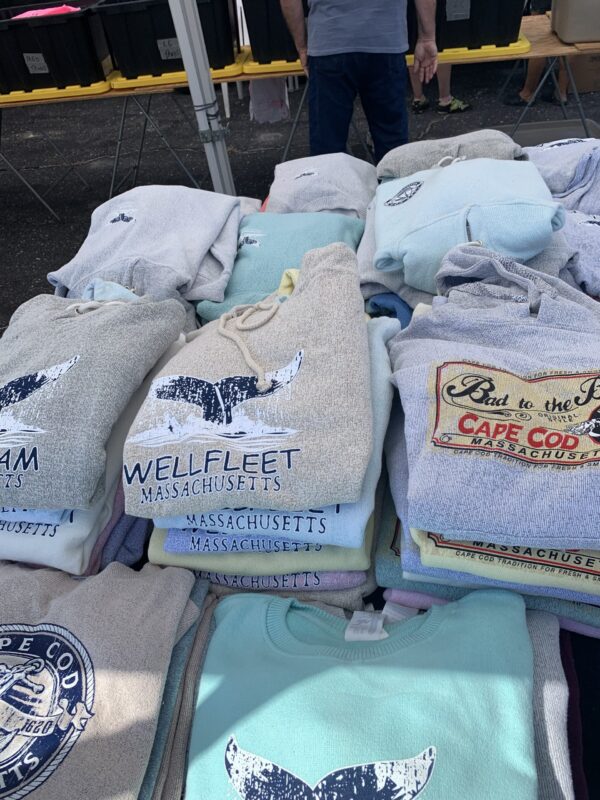 Cape Cod sweatshirts on a vendor table at Wellfleet Flea Market